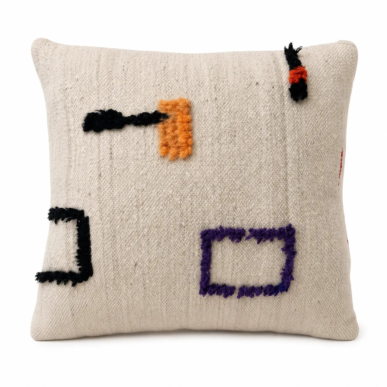 Coussin berbère TANFUST en laine noir, orange, sur fond blanc